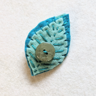 Broche feuillage turquoise vert bouton vintage